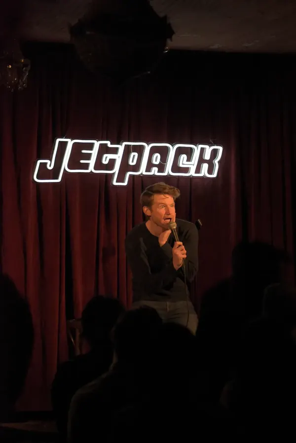 A comedian on the Jetpack stage